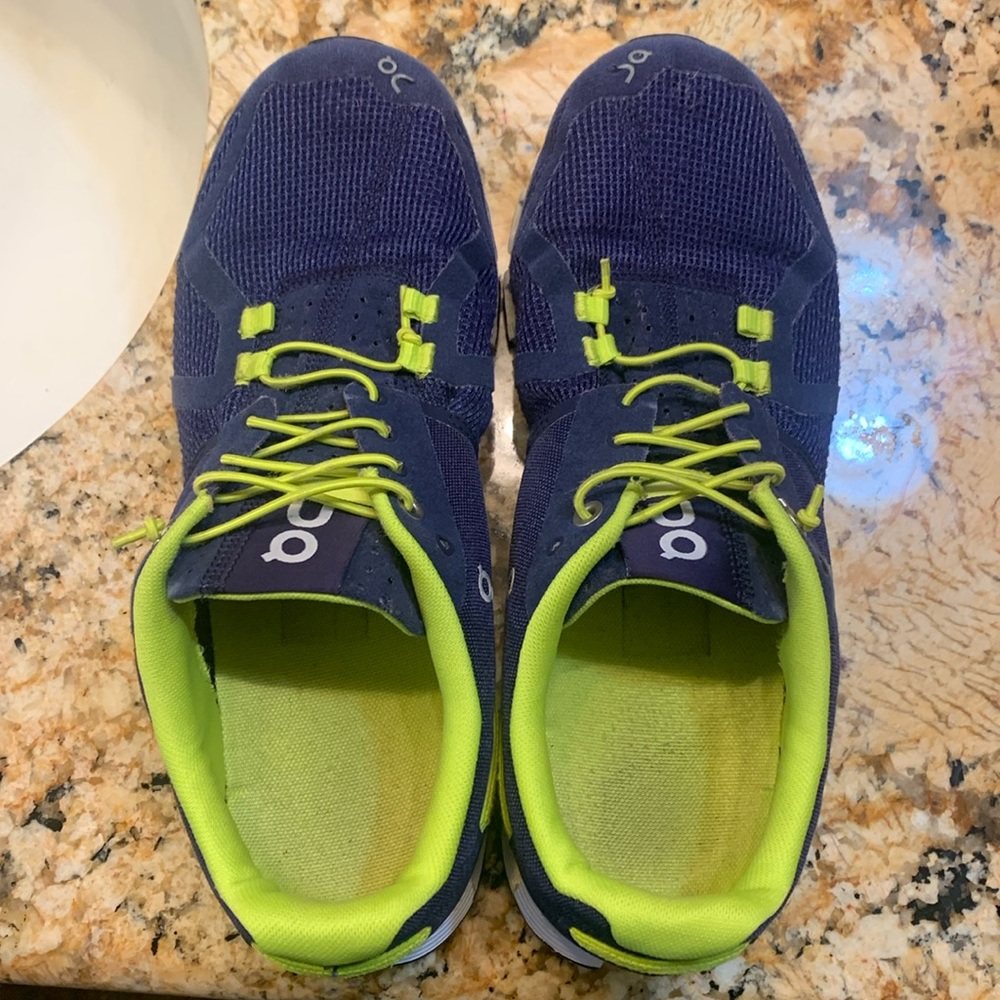 On running  women’s sneakers. Size 9.5 with mesh detail. Clean, Good condition.